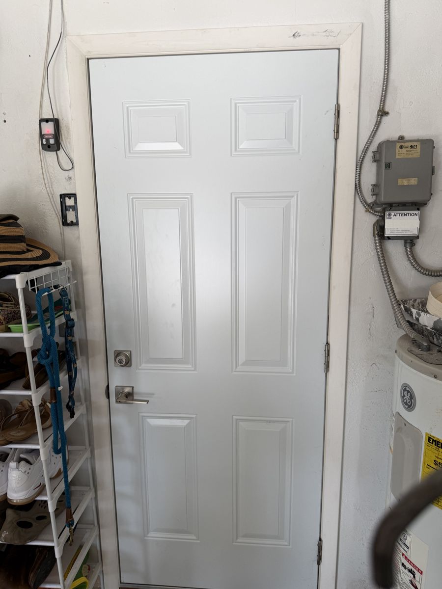 New garage entry door with deadbolt and lever handle in St. Petersburg, FL